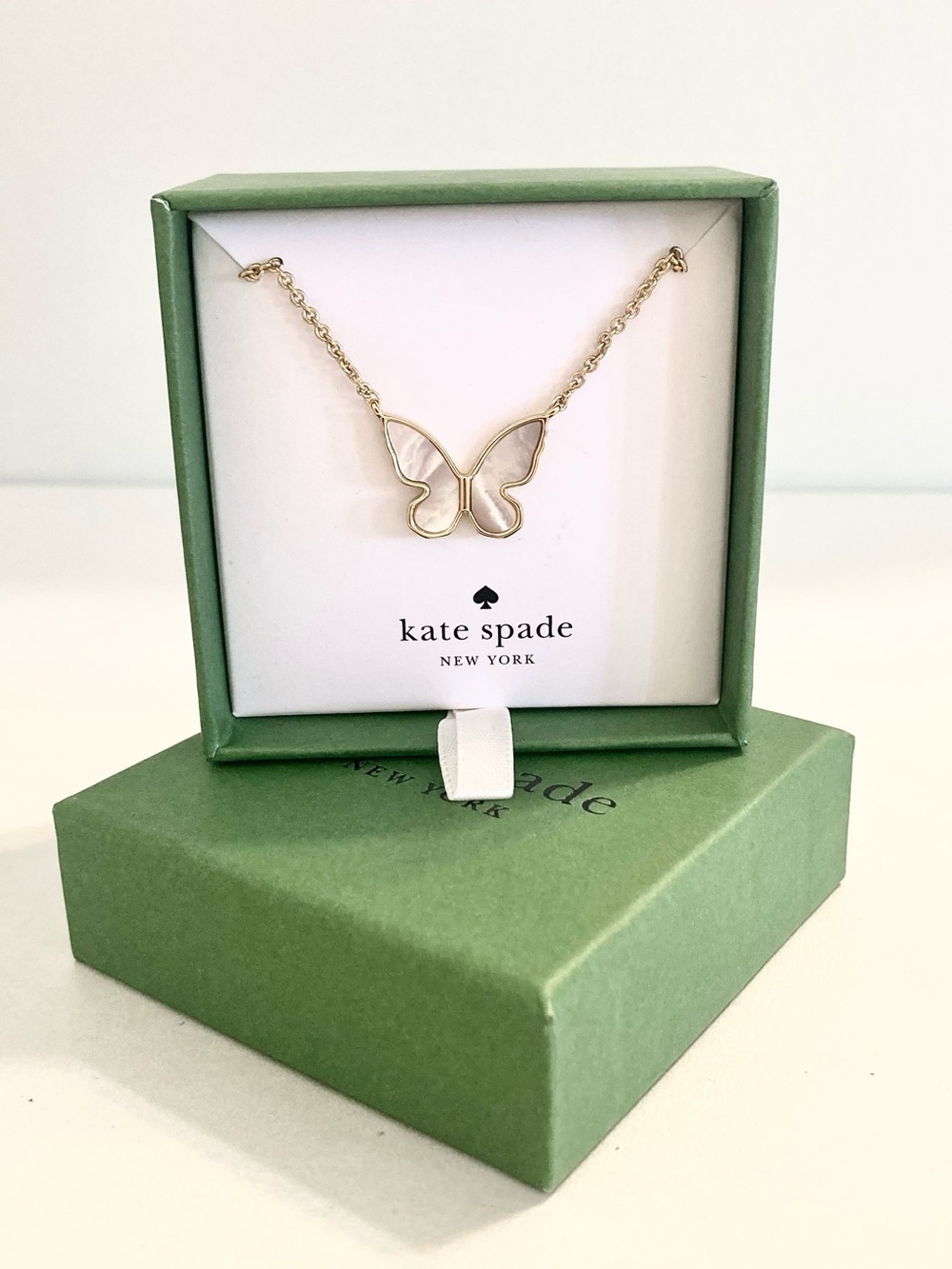 kate spade new in box gold tone butterfly necklace with white inlay, designer